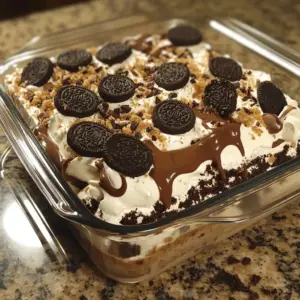 Delicious creamy Oreo Nutella lasagna dessert layered with chocolate and cream