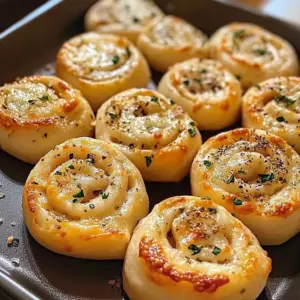 Delicious Garlic Parmesan Pizza Rolls served with dipping sauce