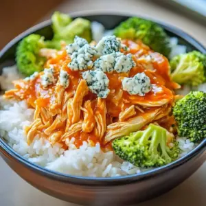 Spicy Buffalo Chicken Bowls topped with fresh ingredients and sauces
